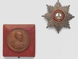 an image of a medal and a medal on a white surface