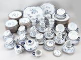 a lot of blue and white dishes and cups and saucers