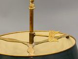 a lamp that has a bird on top of it