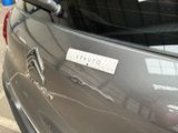 a sticker on the back of a car with a name on it