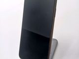 a cell phone that is sitting on top of a stand