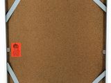 an image of a picture of a cork board with a red sticker on it