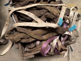 a pile of shoes that are sitting on the ground