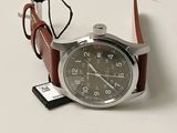 a watch that is sitting on a table next to a memory card
