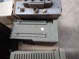 a box of old electrical equipment sitting on the ground