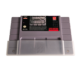 a gray gameboy sitting on top of a white surface