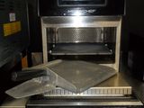 a microwave sitting on top of a table in a room