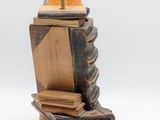 a lamp that is sitting on top of a pile of books