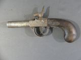 a small gun that is on a table