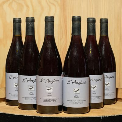 six bottles of wine are lined up on a wooden shelf