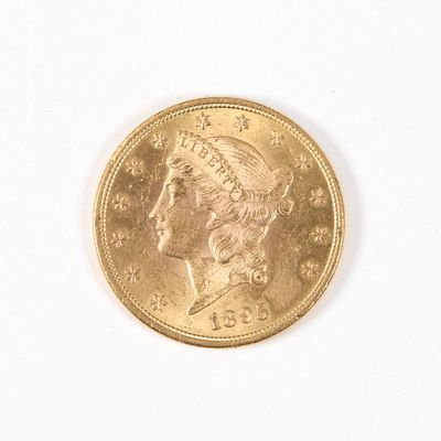 l'image d'une pièce d'or sur laquelle figure une tête de femme