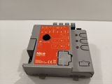 a close up of a small electronic device on a white surface