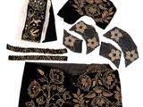 an image of a black and gold dress and accessories on a white background