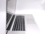 a close up of a laptop computer on a white surface