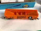 an orange box car sitting on a table next to a box