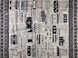 a black and white picture of a rug with a pattern on it