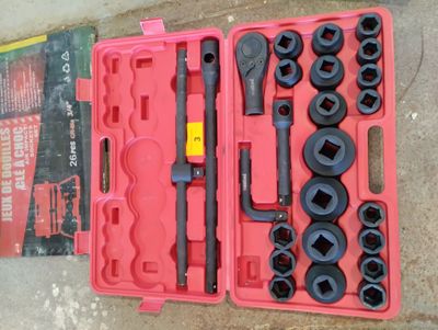 a tool set in a pink case on the ground