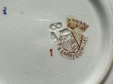 a white plate with a red and blue design on it