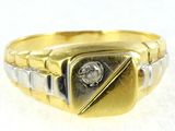 an image of a gold and silver ring with a diamond