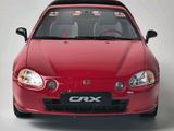 a red car that is sitting on a white surface