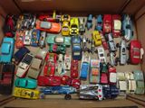 a lot of toy cars in a box on the table