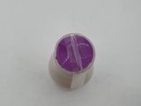 a purple cup sitting on top of a white table