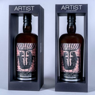 two bottles of artisant are in a black box on a white surface