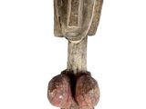 an image of a wooden statue of a man with a hat on