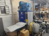 a room with a lot of boxes and a machine in it