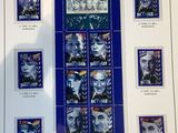a picture of a sheet of stamps with pictures of people on them