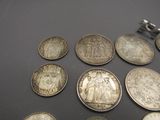 a lot of coins that are sitting on a table