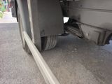 a close up view of a flat tire on a truck