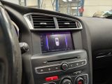 a car dashboard with a radio and a steering wheel