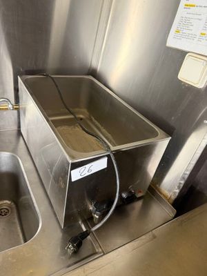 a stainless steel sink with a faucet and a faucet