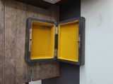 an open box that is on the wall next to a wall