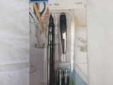 two pens that are in the package on the bed