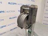 a close up of a puller on a metal pole in front of a wall