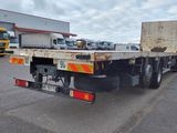 an image of a flatbed truck parked in a parking lot