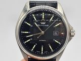 a close up of a wrist watch with a black dial