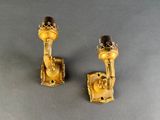 pair of antique brass candlesticks with garnish decoration