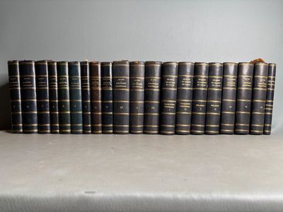a bunch of books sitting on top of a table next to each other