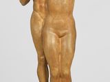 statue of a man and a woman holding hands on a pedestal