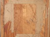 an old picture of a wooden frame with a picture on it