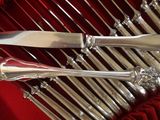 two knives in a red case on a table