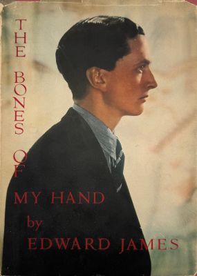 an old book with a picture of a man in a suit and tie