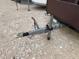 a trailer with a trailer hitching device attached to it