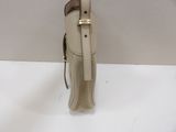 beige and brown leather handbag on white surface