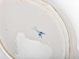 a close up of a plate with a blue bird on it