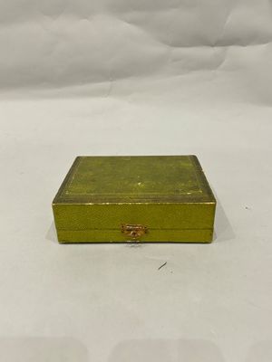 yellow metal box with a gold handle on a white background