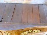 a wooden table with a mirror on top of it